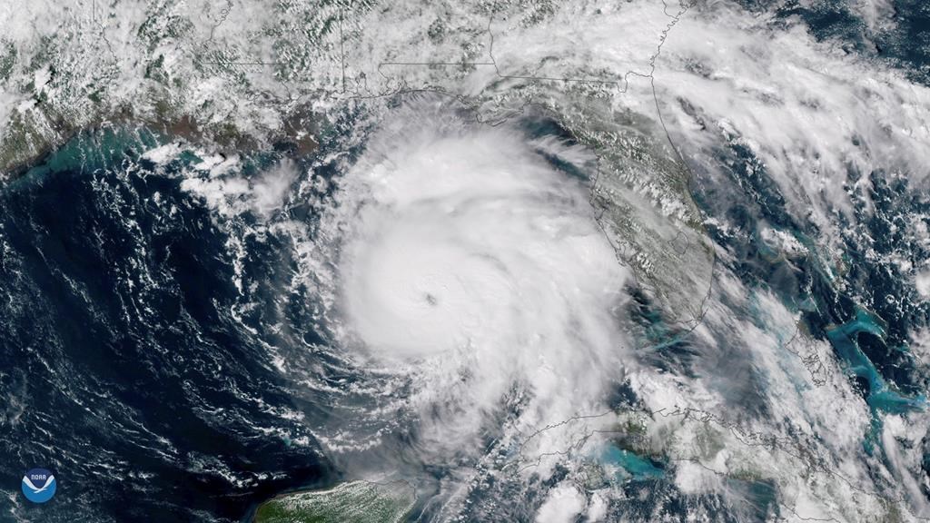 This Tuesday, Oct. 9, 2018, satellite image provided by NOAA shows Hurricane Michael, centre, in the Gulf of Mexico.