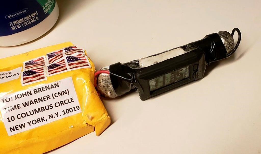 This image obtained Wednesday, Oct. 24, 2018, and provided by ABC News shows a package addressed to former CIA head John Brennan and an explosive device that was sent to CNN's New York office. The mail-bomb scare widened Thursday as law enforcement officials seized more suspicious packages. (ABC News via AP).