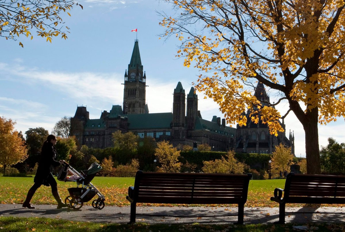 A woman walks with a stroller at Major's Hill Park in Ottawa on Monday Oct 11, 2010.