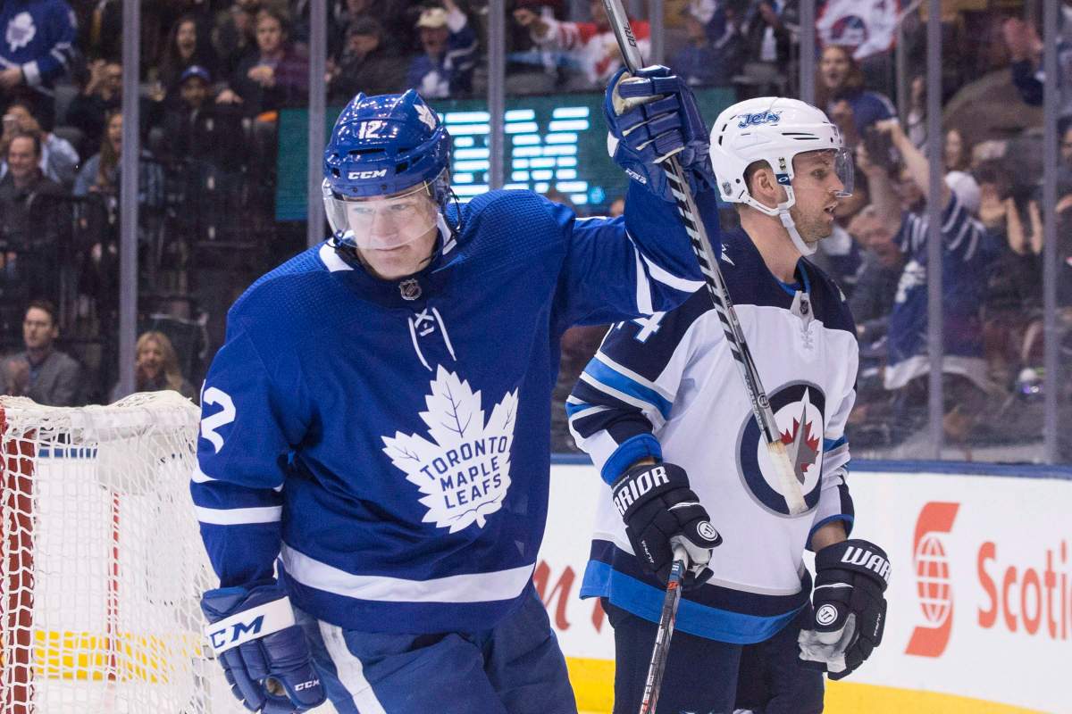 Toronto Maple Leafs' Patrick Marleau (12) celebrates scoring his team's opening goal during second period NHL hockey action against the Winnipeg Jets, in Toronto on Saturday, March 31, 2018.