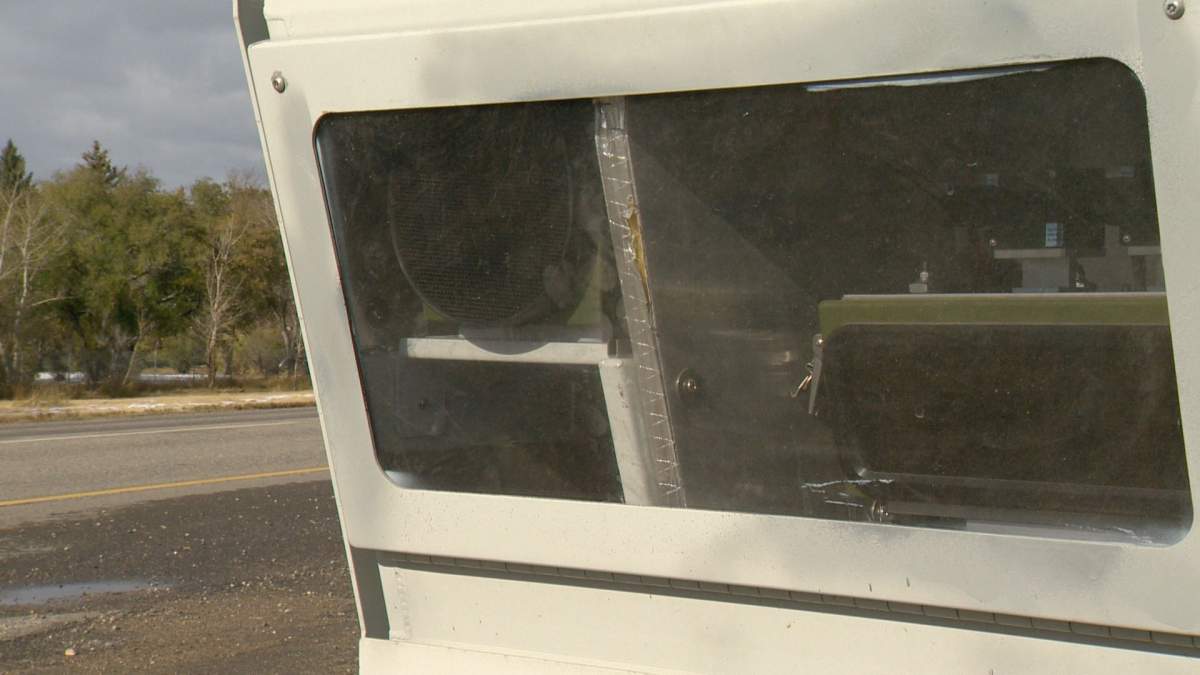 A photo radar camera placed at an intersection.