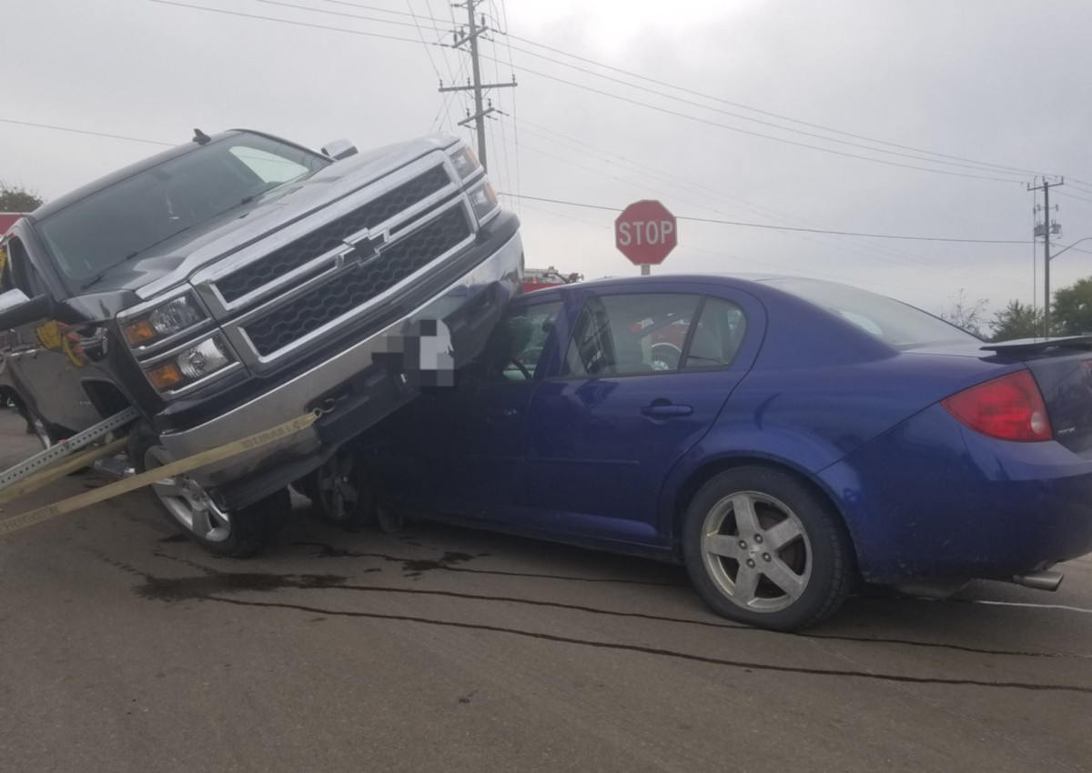 Pickup truck drives over car in Waterford - image