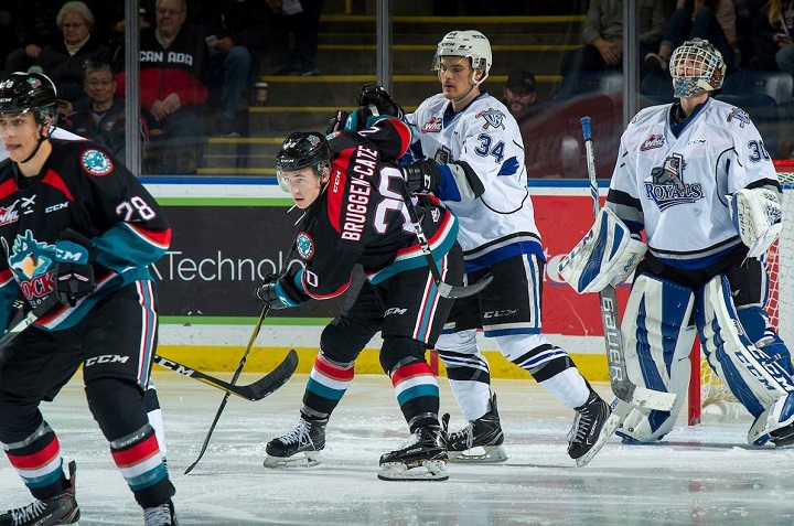 Conner Bruggen-Cate of the Kelowna Rockets and Kaid Oliver of the Victoria Royals battle for space in front of Victoria goaltender Griffen Outhouse during WHL action at Prospera Place in Kelowna on Friday night.