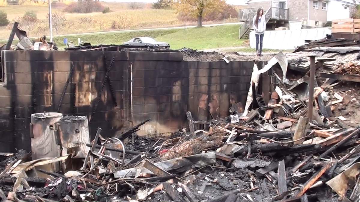 Kelsey Greer looks at what’s left to her mother’s house after fire destroyed a home in Roseneath on Tuesday night.