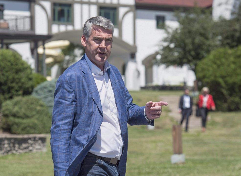 Nova Scotia Premier Stephen McNeil heads to talk with reporters as the Canadian premiers meet in St. Andrews, N.B. on July 19, 2018.