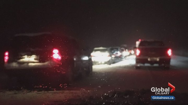 Drivers were stranded for up to 11 hours on Highway 1 near Canmore after a massive snowfall on Tuesday.