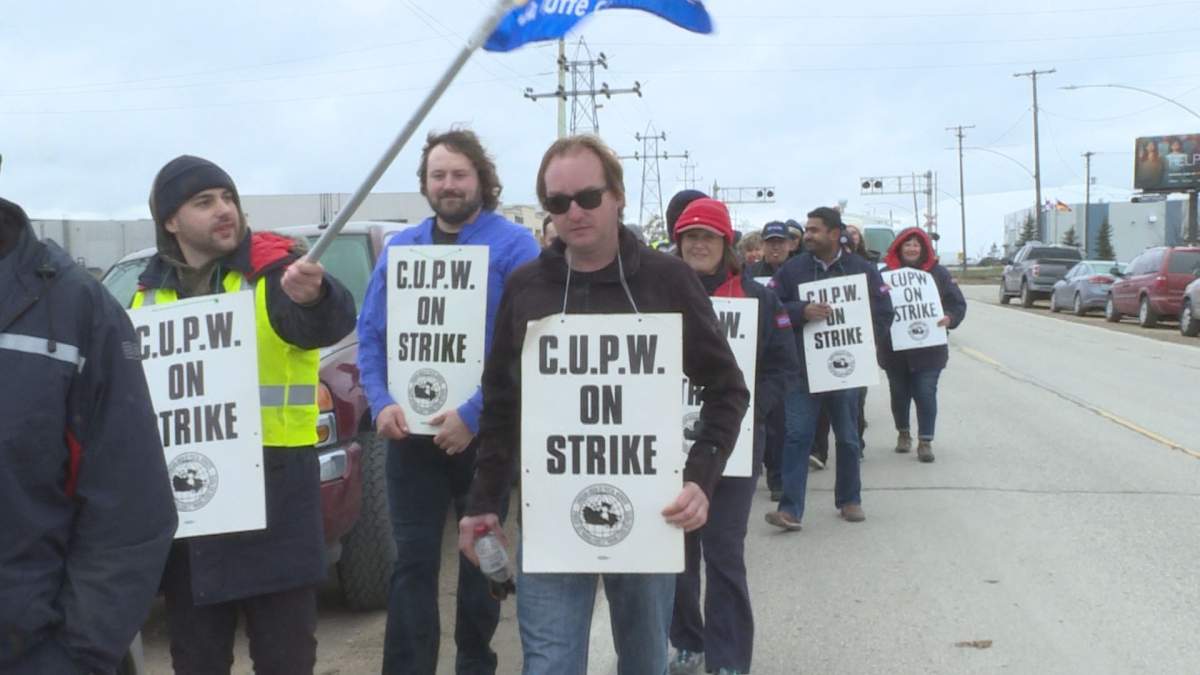 Canada Post workers picket Monday.