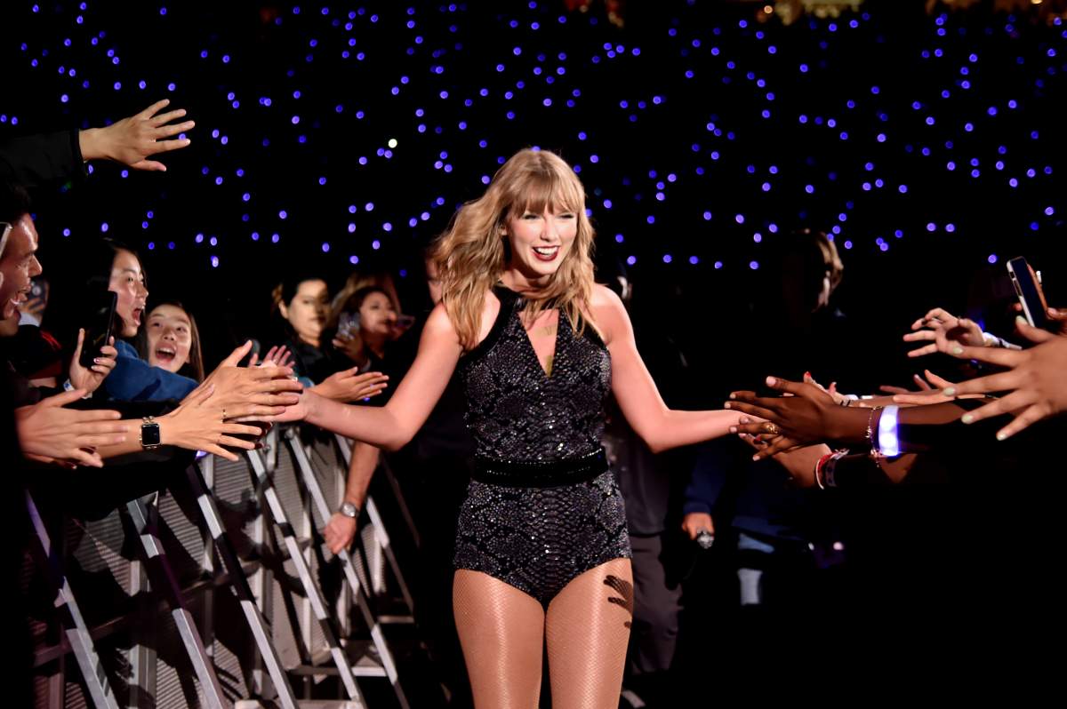 Taylor Swift high-fives fans during the Reputation stadium tour at Levi’s Stadium on May 11, 2018 in Santa Clara, Calif.
