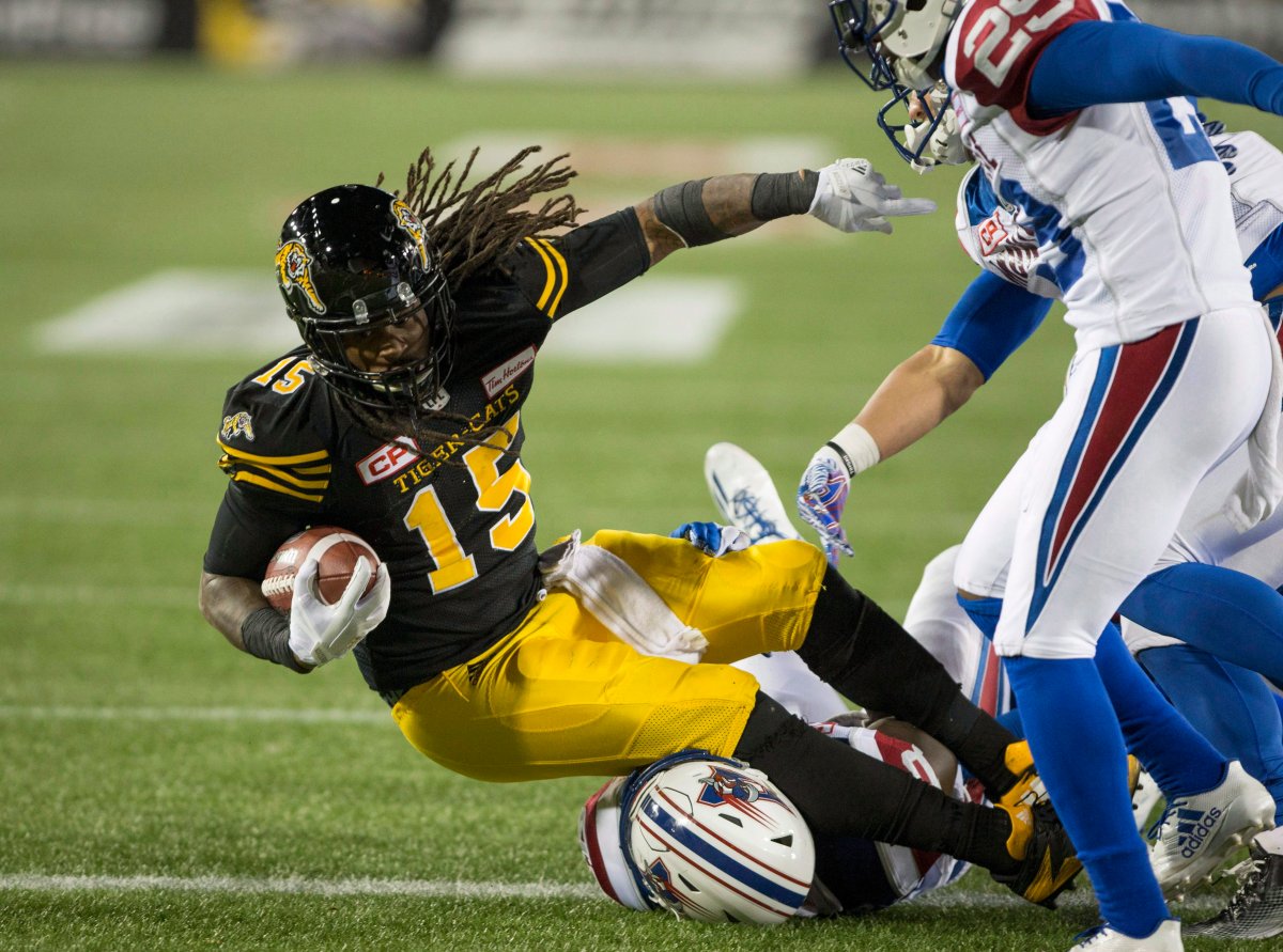 Hamilton Tiger-Cats running back Alex Green (15) crosses the line for his touchdown during second half CFL football action in Hamilton, Ont., on Friday, November 3, 2017.