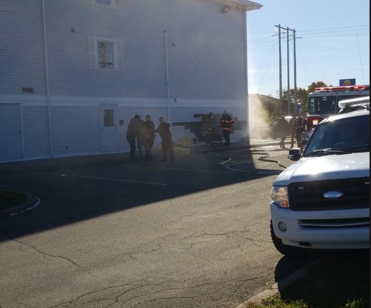 Emergency crews attend the Travel Lodge hotel in New Glasgow after an alleged impaired driver crashed into the side of the building on Friday, Oct. 19, 2018. 
