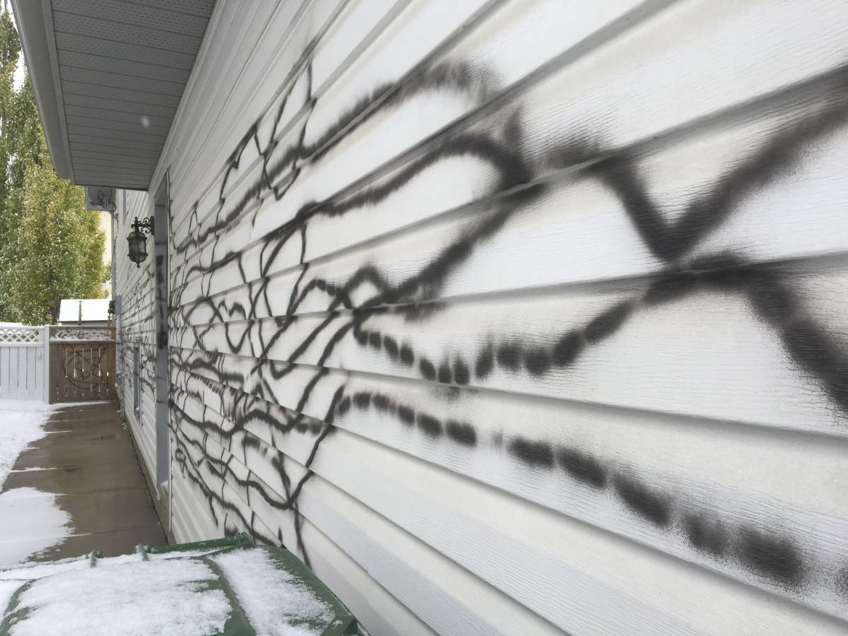 The side of the Airdrie home was spray-painted.