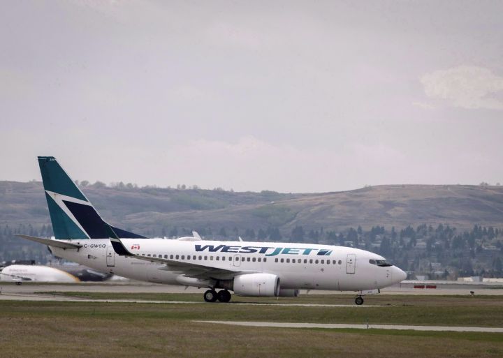 WestJet planes are seen at the Calgary Airport in Calgary, Alta., on Thursday, May 10, 2018.