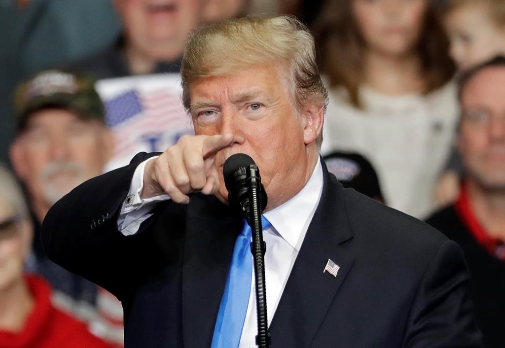 In this Oct. 26, 2018 photo, President Donald Trump points to the media as he speaks during a campaign rally in Charlotte, N.C. Trump is accusing the media of being ‚Äúthe true Enemy of People‚Äù in the wake of a mass shooting and a mail bomb plot.(AP Photo/Chuck Burton).