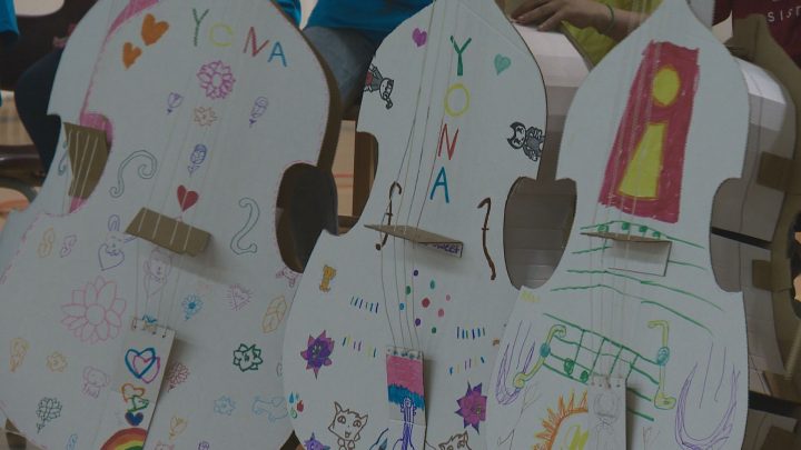 After learning music basics and proper instrument care with plastic and cardboard versions, 20 students graduated to the real thing on Tuesday.