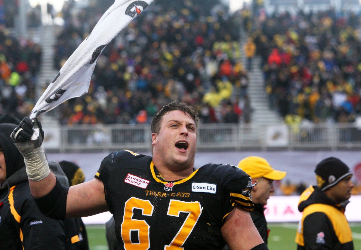 Ti-Cat's Peter Dyakowski gets the crowd going during fourth quarter CFL Eastern-Semi final action between the Montreal Alouettes and the Hamilton Tiger Cats, in Guelph, Saturday, Nov. 2013.  (CFL PHOTO - Dave Chidley).