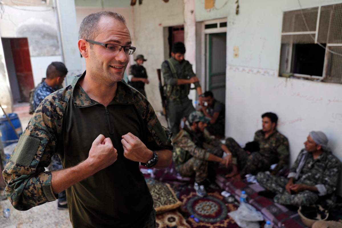 Macer Gifford gives an interview to The Associated Press in Raqqa, northeast Syria on July 17, 2017, when several U.S. and British volunteer fighters were on the front lines in the decisive battle against IS for the Syrian city. (AP Photo/Hussein Malla)