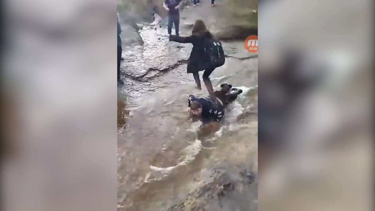 Video shows a young girl stepping on the 14-year-old and using him like a bridge.