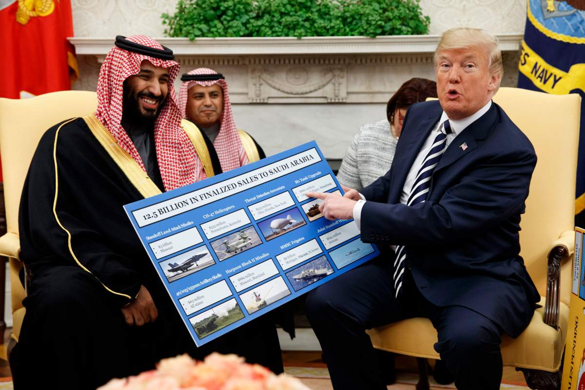 FILE - In this March 20, 2018 file photo, President Donald Trump shows a chart highlighting arms sales to Saudi Arabia during a meeting with Saudi Crown Prince Mohammed bin Salman in the Oval Office of the White House, in Washington. (AP Photo/Evan Vucci, File).