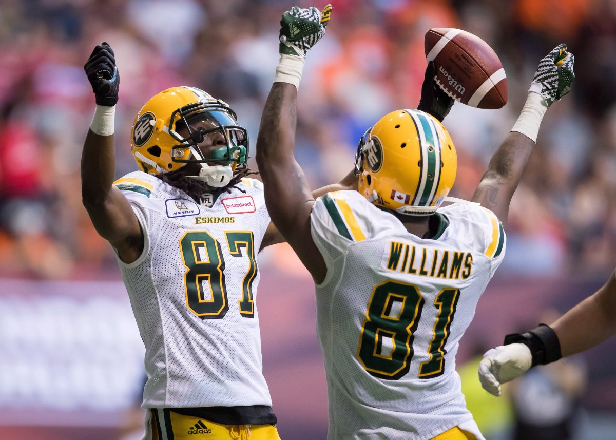 Edmonton Eskimos' Derel Walker (87) and D'haquille Williams (81) celebrate Walker's touchdown reception during first half CFL football action against the B.C. Lions, in Vancouver on Thursday, August 9, 2018. 