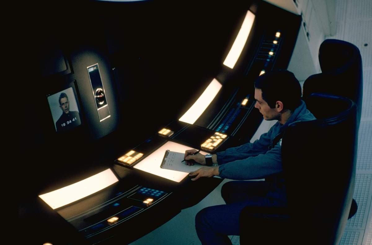 Douglas Rain voiced the sentient supercomputer HAL 9000 (left) in 2001: A Space Odyssey. At right is actor Keir Dullea on the set of the film in England.