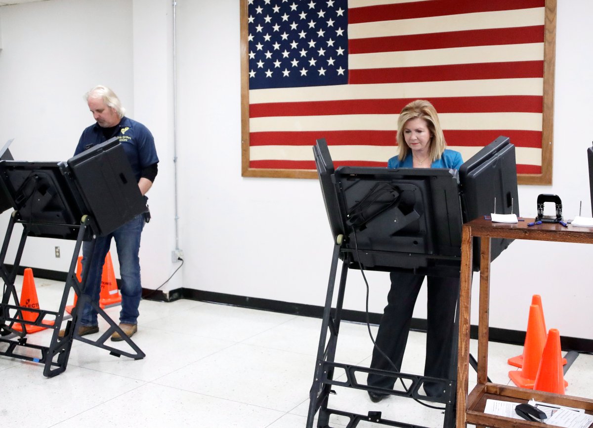 U.S. Rep. Marsha Blackburn, right, the Republican nominee for Senate, casts her ballot during early voting Wednesday, Oct. 31, 2018, in Franklin, Tenn. 