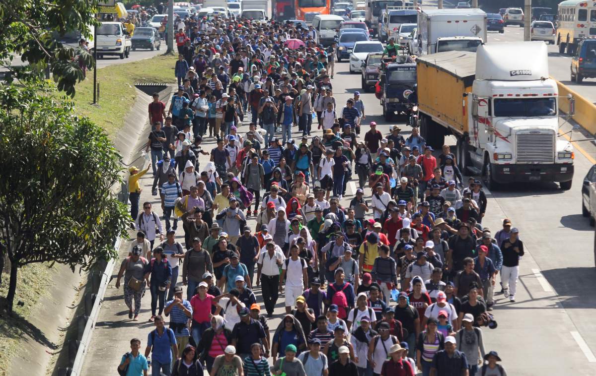 Migrants from El Salvador start on their way to the United States, in San Salvador, El Salvador, Wednesday, Oct. 31, 2018.