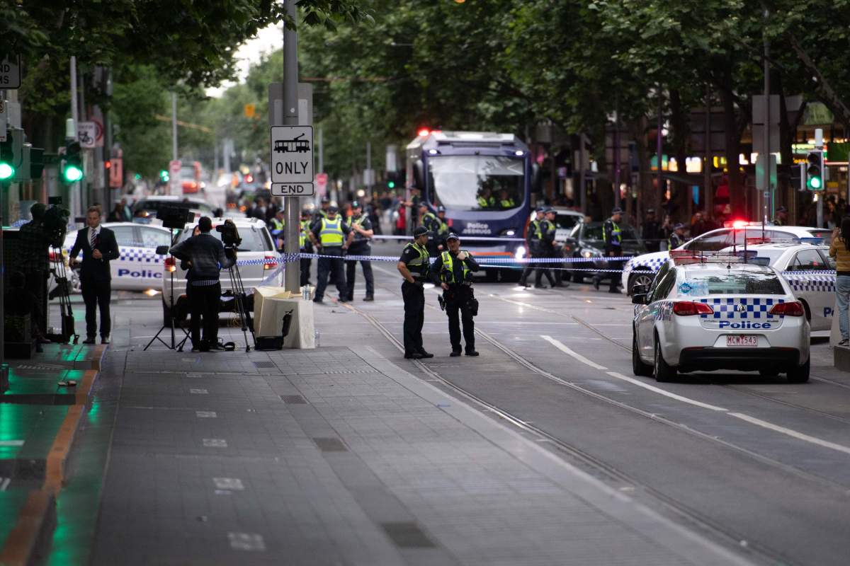 Policemen guard at the site where a man attacked others in Melbourne, Australia, on Nov. 9, 2018.