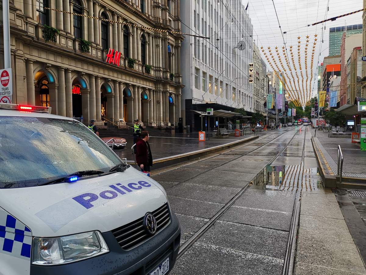 Policemen guard at the site where a man attacked others in Melbourne, Australia, on Nov. 9, 2018.