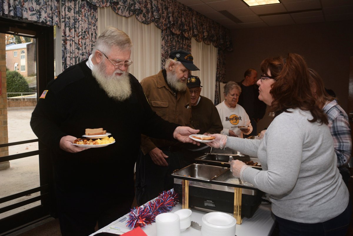 Penny Klinger, right, physician liaison at Lehigh Valley Hospital Schuylkill East, of Hegins, Pa., serves George Hosler, at the veterans breakfast at Lehigh Valley Hospital Schuylkill East in Pottsville, Pa., on Saturday, Nov. 10, 2018. Next in line is Daniel Eifert, Cressona, Pa., commander of American Legion Post 286 Cressona.