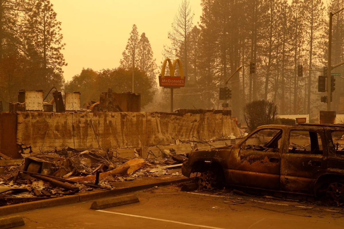 A sign still stands at a McDonald’s restaurant burned in the Camp Fire, Monday, Nov. 12, 2018, in the northern California town of Paradise.