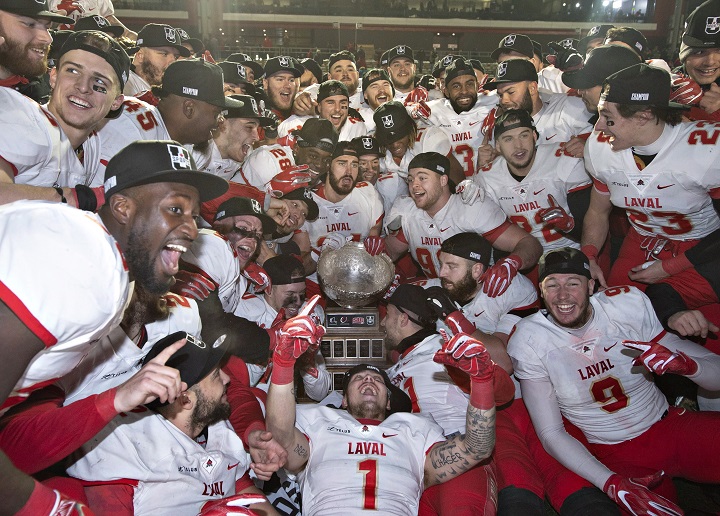 Members of the Laval University Rouge et Or celebrate their victory against Western University Mustangs at the Vanier Cup final Saturday, November 24, 2018 in Quebec City. Laval won 34-20. 