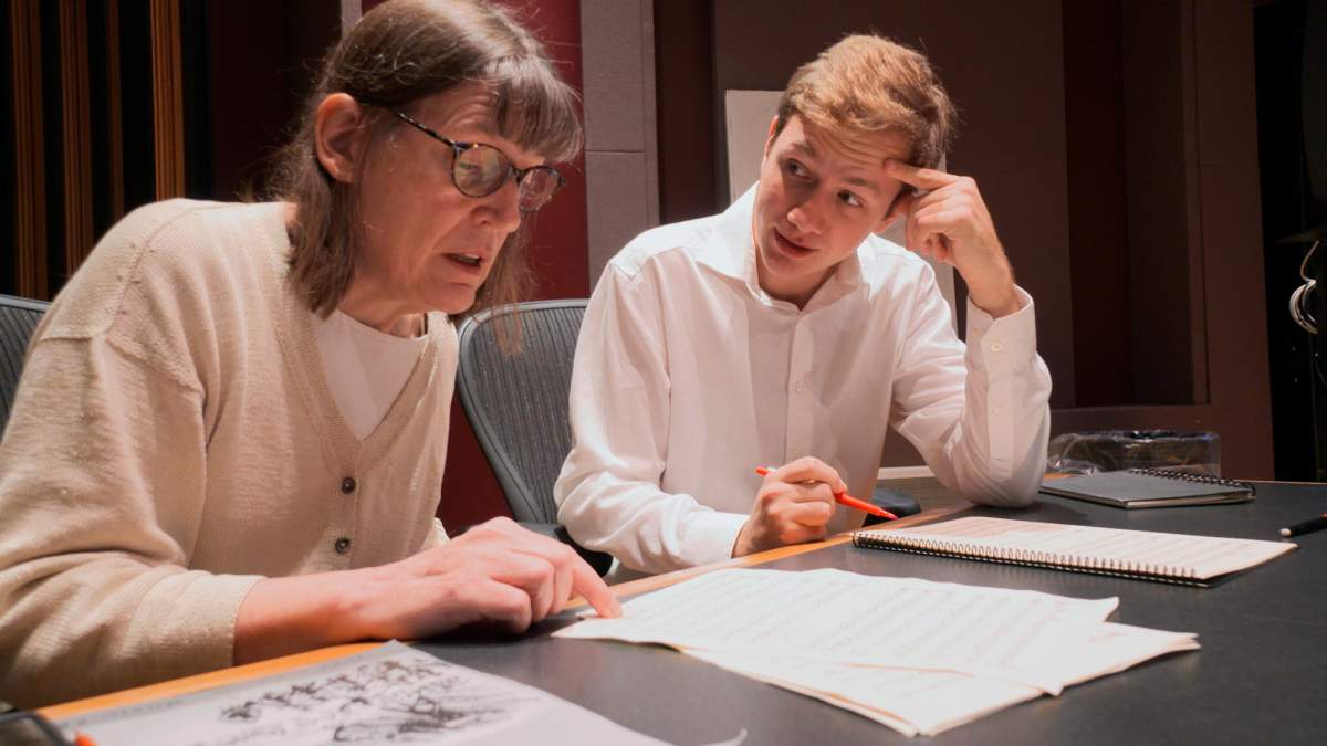 This Nov. 7, 2018, photo provided by the University of Michigan shows Professor Patricia Hall and graduate student Joshua Devries reviewing the music manuscript for “The Most Beautiful Time of Life” at the Duderstadt Center recording studio on campus in Ann Arbor, Mich. The Contemporary Directions Ensemble in October 2018 recorded the music, as it’s translated from German to English. It will perform the piece Friday, Nov. 30, 2018, during a free on-campus concert. The music has not been heard since it was arranged and performed by prisoners in a World War II death camp. (Christopher Boyes/University of Michigan via AP)