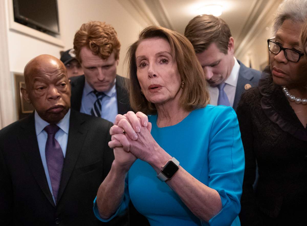 Democratic Leader Nancy Pelosi of California, center, joined by, from left, Rep. John Lewis, D-Ga., Rep. Joe Kennedy III, D-Mass., Rep. Eric Swalwell, D-Calif., and Rep. Joyce Beatty, D-Ohio, on Nov. 28, 2018.