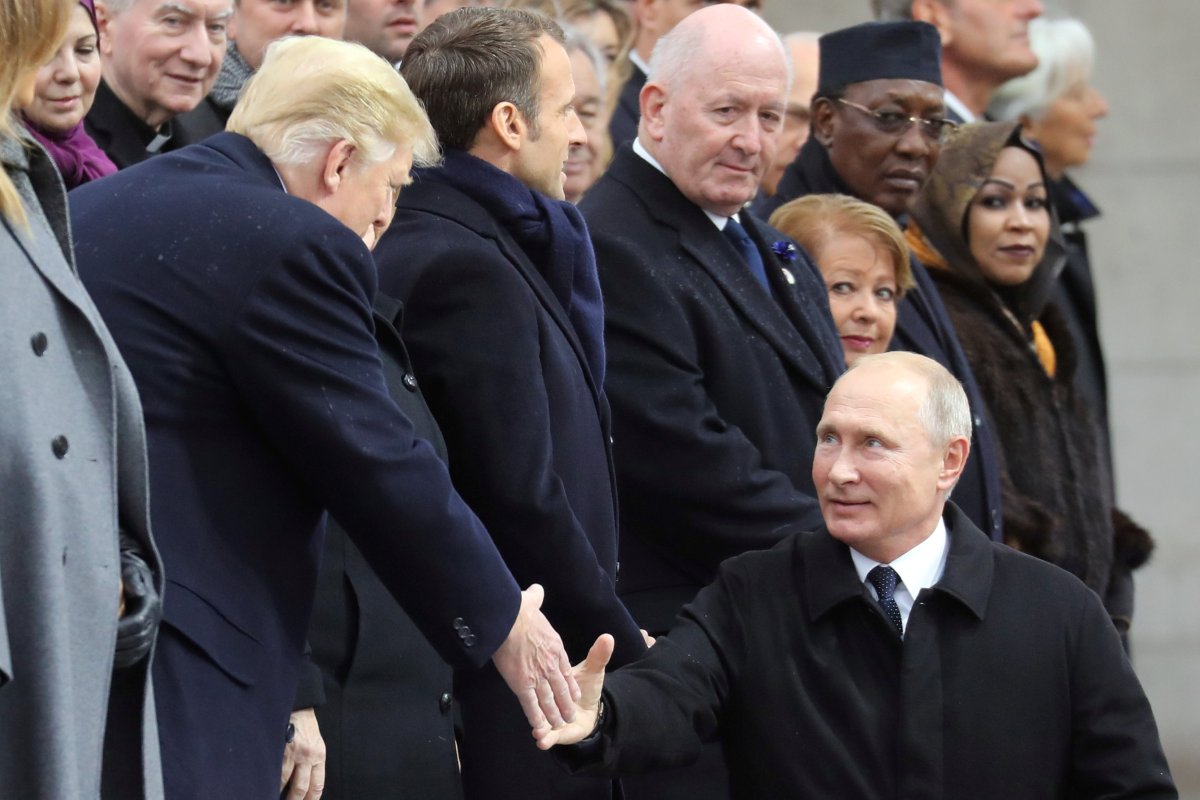 Russian President Vladimir Putin shakes hands with U.S. President Donald Trump as he arrives to attend a commemoration ceremony for Armistice Day, 100 years after the end of the First World War at the Arc de Triomphe, in Paris, France, November 11, 2018. 