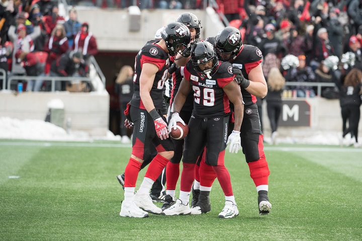 Nov 18, 2018; Ottawa, Ontario, CAN; Ottawa Redblacks running back William Powell (29) celebrates with teammates after scoring in the first half of the 2018 CFL Eastern Conference Final against the Hamilton Tiger-Cats at TD Place Stadium. 