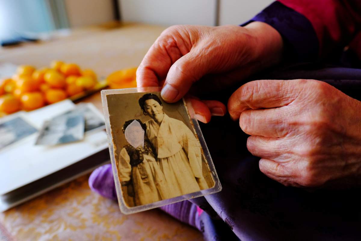 Lee Yong-soo, 90, one of less than 30 known surviving South Korean victims of JapanÕs wartime brothels, displays a photograph in Daegu, South Korea October 30, 2018, of her taken shortly after she returned to Korea in 1945 after being held at an airbase for kamikaze pilots in Taiwan.