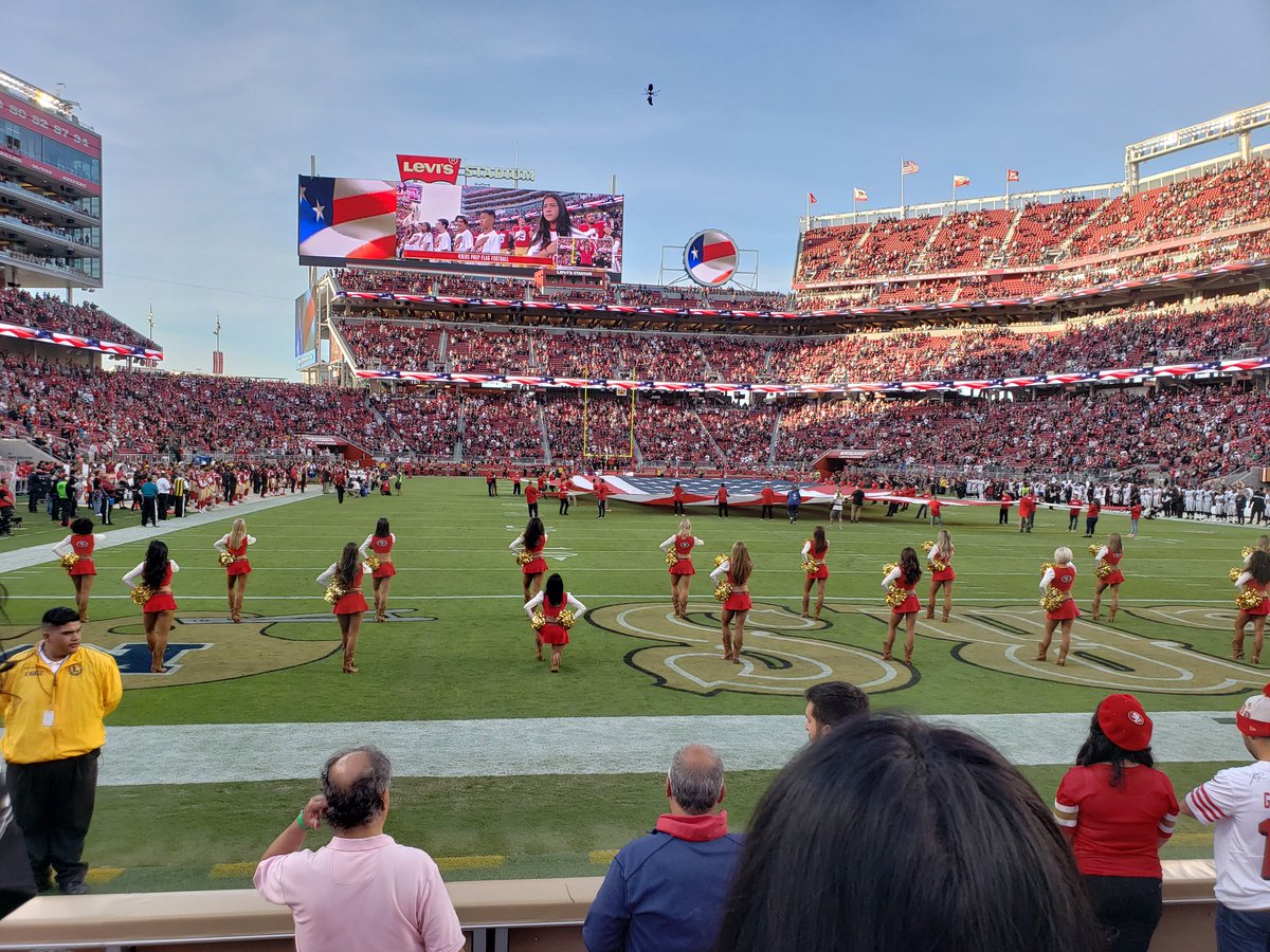 A cheerleader takes a knee at an NFL Game on Nov. 1/ 2018, .