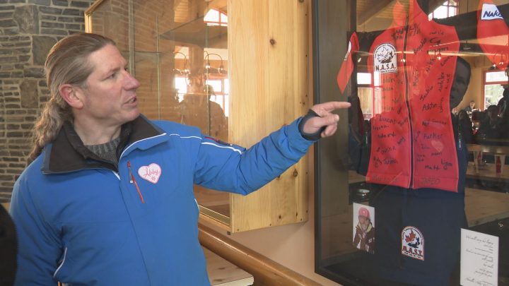 David Wunsch and his daughter’s ski team jacket at Nakiska Ski Area.