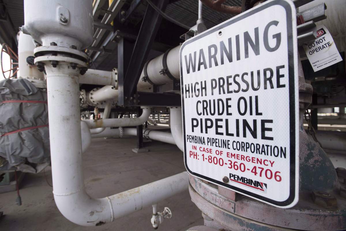 Pipes are seen at the Kinder Morgan Trans Mountain facility in Edmonton on April 6, 2017. Social commentator Rex Murphy says it should be illegal for Canada to collect carbon taxes until there are new oil export pipelines leaving Alberta to world markets. A sold-out audience at the Bennett Jones Lake Louise World Cup Business Forum leaped to their feet in a standing ovation as the former CBC commentator ended a fiery speech criticizing environmentalists and federal politicians alike for stalling pipelines.  