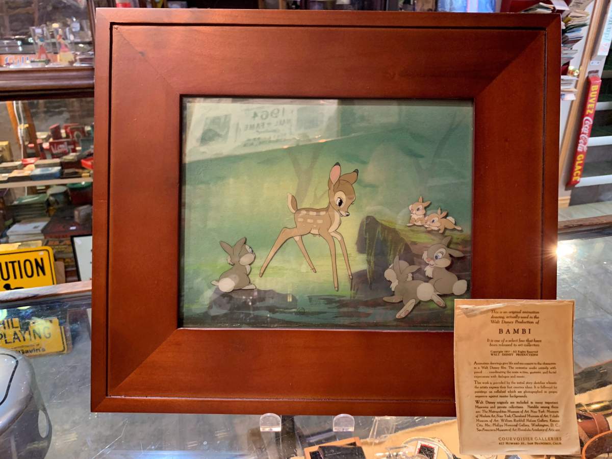 A framed animation drawing from the movie "Bambi" is seen in this undated handout photo. The owner of an Edmonton antique shop is helping out a homeless man who found a valuable Bambi animation drawing in a dumpster. Alexander Archbold of Curiosity Inc. says the man he knew only as Adam had been turned away by a few stores before he showed up in his shop with the artwork in September.