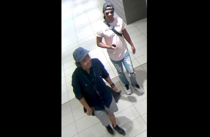 Police seek two persons of interest after photos were taken of a teenager inside the bathroom of an Oshawa shopping mall on Aug. 14, 2018.