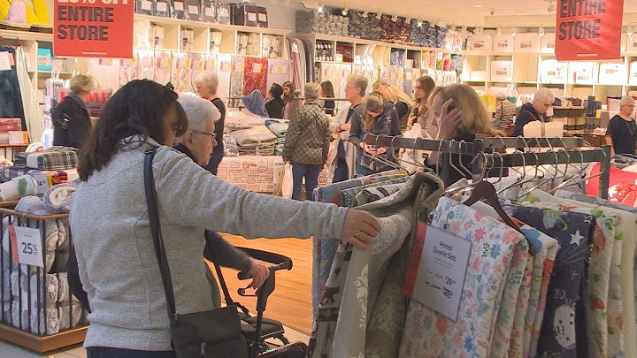 Shoppers came out in droves to Vernon’s Village Green mall to find bargains, including ones at this quilt store.