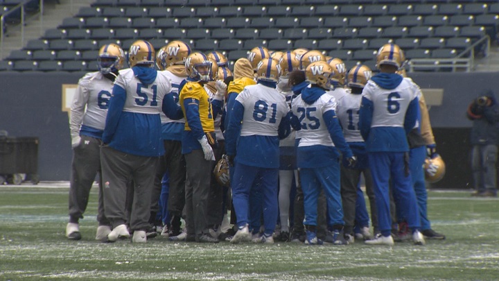 Players on the Winnipeg Blue Bombers meet at centre field during practice on Wednesday at Investors Group Field.