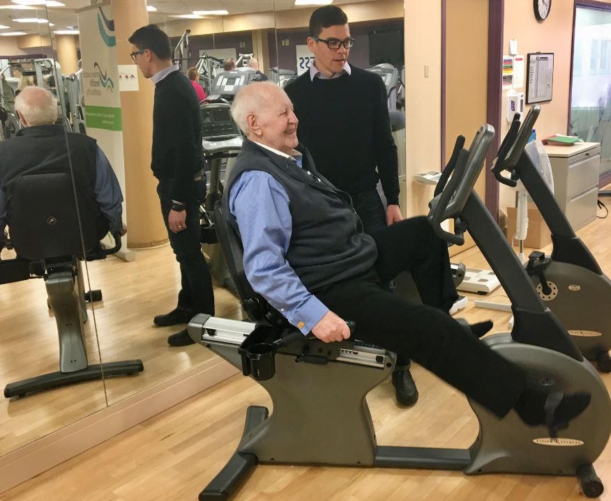 Former Nova Scotia premier John Buchanan (left) is shown with Jeff Zahavich, Certified Exercise Physiologist, ACCESS wellness program. Buchanan says the exercises have improved the range of movement in his arms and shoulders and his general mobility as he's been treated for prostate cancer that spread into other parts of his body. 