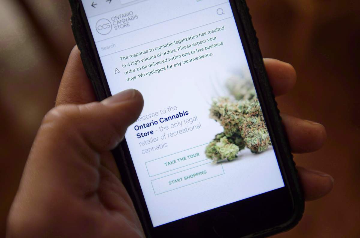 The Ontario Cannabis Store website is pictured on a mobile phone Ottawa on Thursday, Oct. 18, 2018. The Canadian Press placed 13 online orders on the afternoon of Oct. 17 of the cheapest available gram of dried flower in each province and territory available across the country - and three have still yet to arrive more than one week later. 