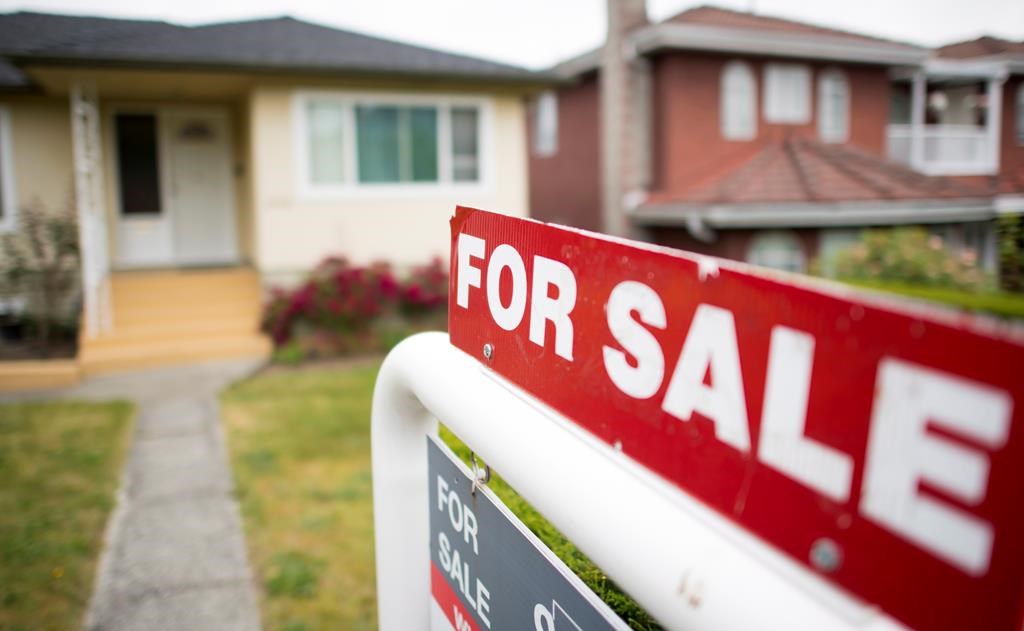 A real estate sign is pictured in Vancouver on June, 12, 2018.