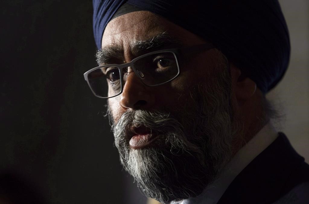 Minister of National Defence Minister Harjit Sajjan speaks with the media following a cabinet meeting on Parliament Hill in Ottawa, Wednesday October 24, 2018.
