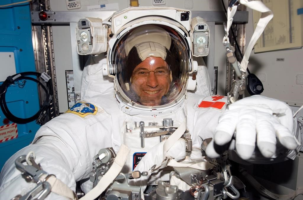 Canadian astronaut Dave Williams in his spacesuit getting ready for a spacewalk in a NASA handout photo.