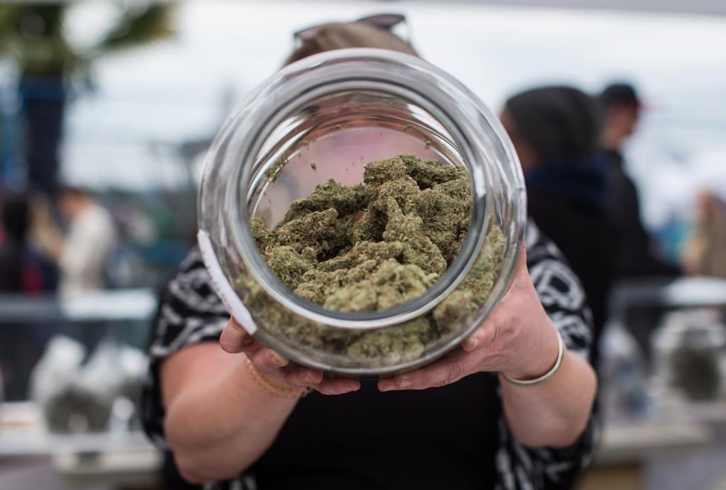 The Saskatchewan government and a First Nation are at odds over whether an unlicensed cannabis store is illegal. A vendor displays marijuana for sale during the 4-20 annual marijuana celebration in Vancouver on Friday, April 20, 2018.