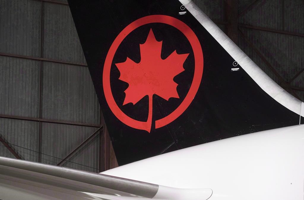 The tail of the newly revealed Air Canada Boeing 787-8 Dreamliner aircraft is seen at a hangar at the Toronto Pearson International Airport in Mississauga, Ont., Thursday, February 9, 2017. THE CANADIAN PRESS/Mark Blinch.